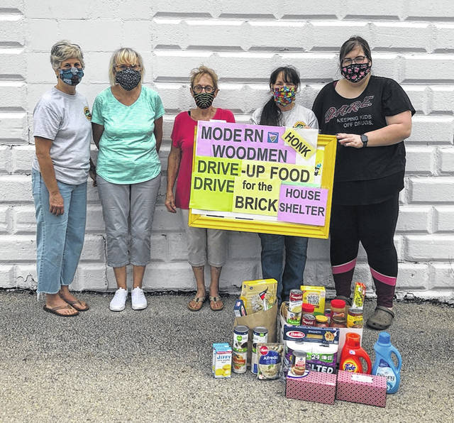 Modern Woodmen members hold personal care drive-through
