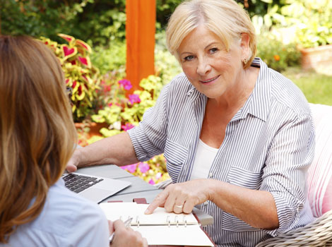 woman pointing at a piece of paper