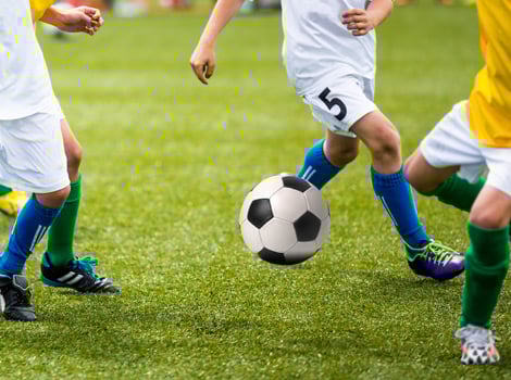 children playing soccer
