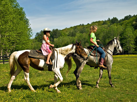 two children riding horses