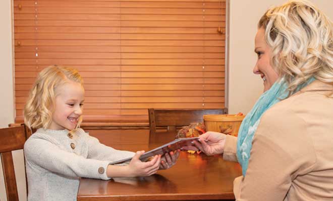 Young Modern Woodmen member enjoys birthday books.